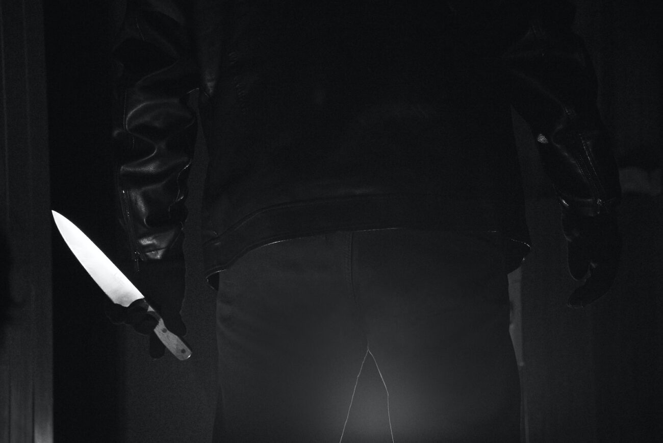 man in black suit jacket and black pants