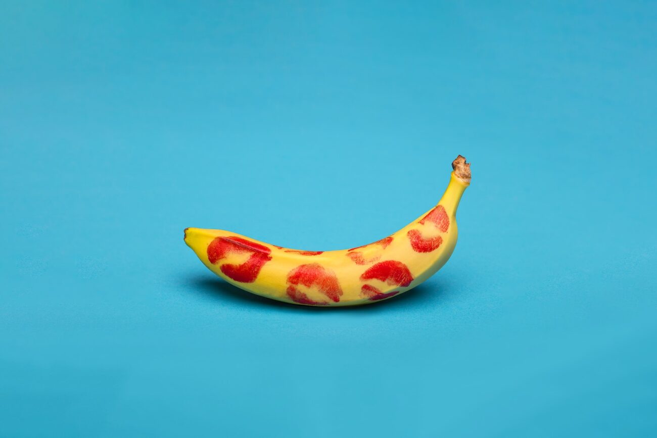 yellow banana fruit on blue surface