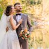 man in gray suit and woman in white wedding dress