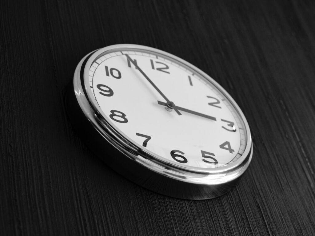 a close up of a clock on a table