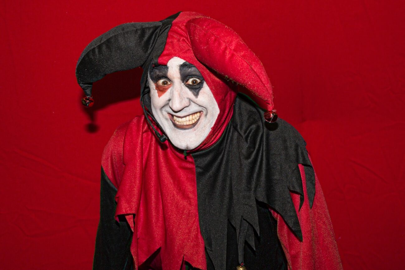 man in red and black robe