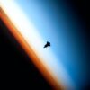 Space Shuttle orbits above earth atmosphere