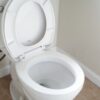white ceramic toilet bowl with cover
