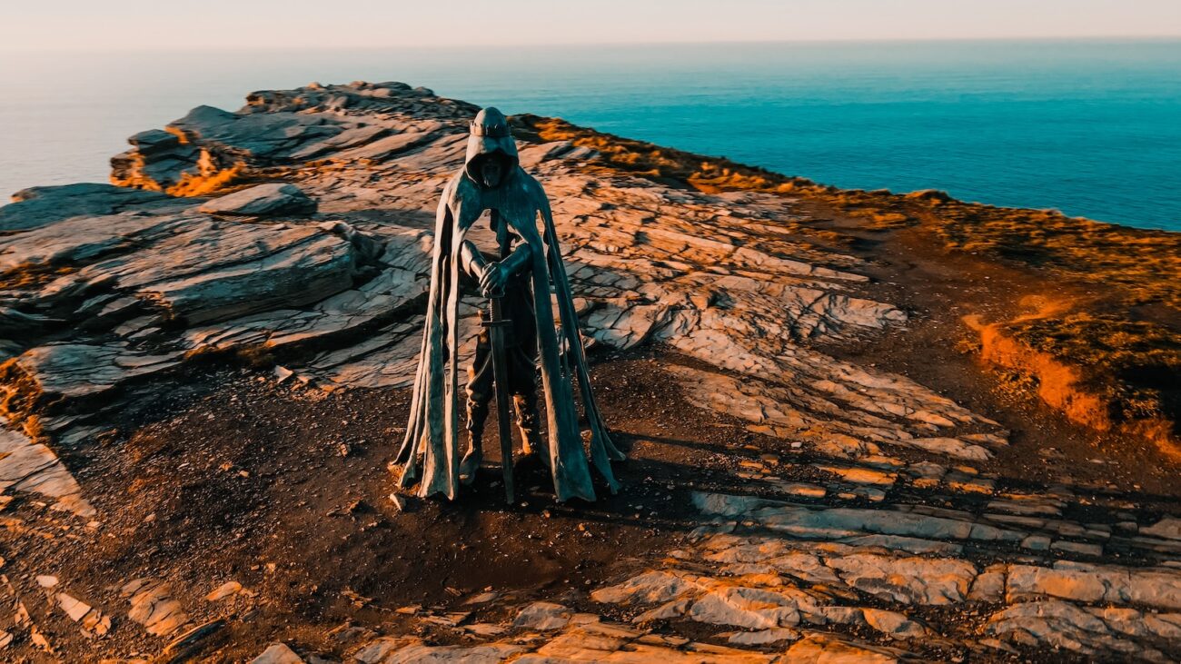 a piece of wood sitting on top of a rocky cliff