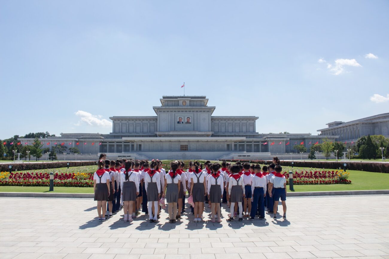 people standing on white concrete floor during daytime