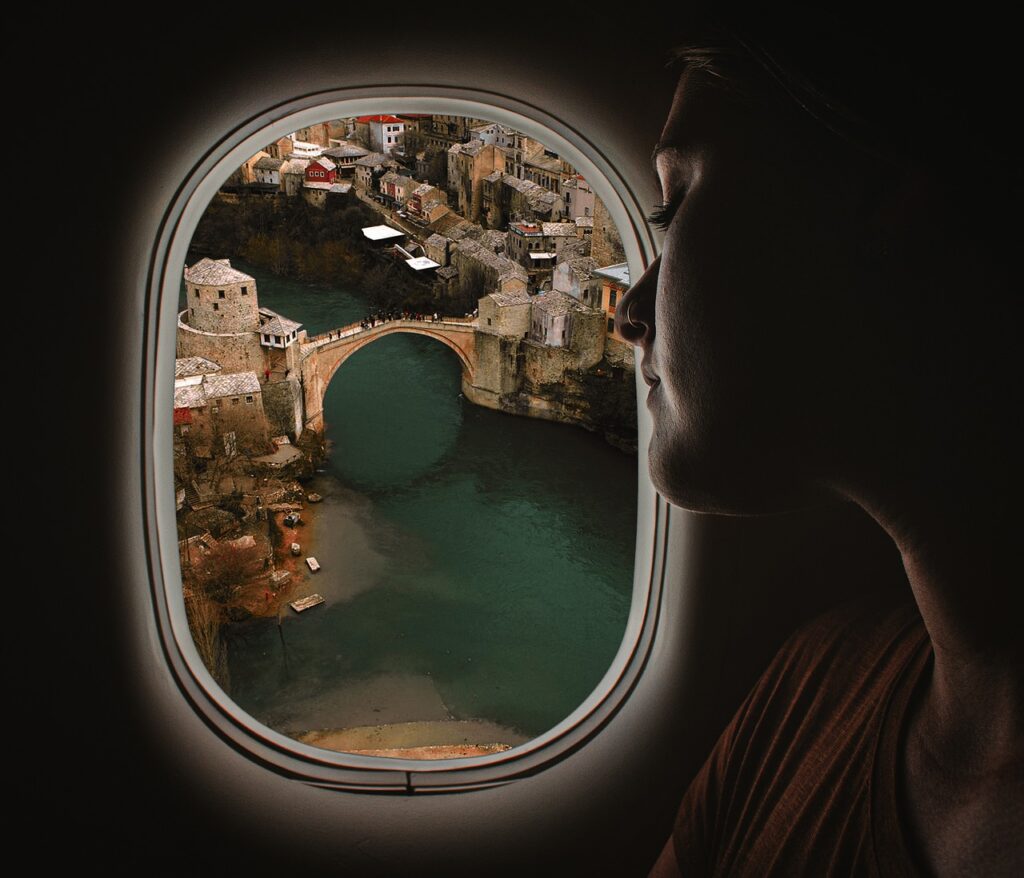 Airplane Window View Woman  - AlemCoksa / Pixabay