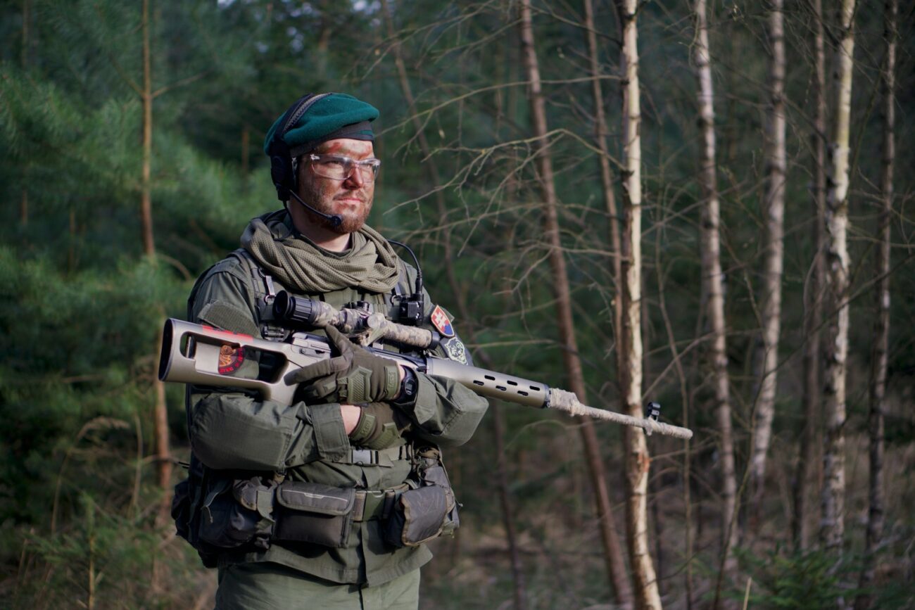 soldier man holding assault rifle standing