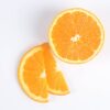 sliced orange fruit on white surface