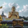 gold buddha statue under cloudy sky during daytime