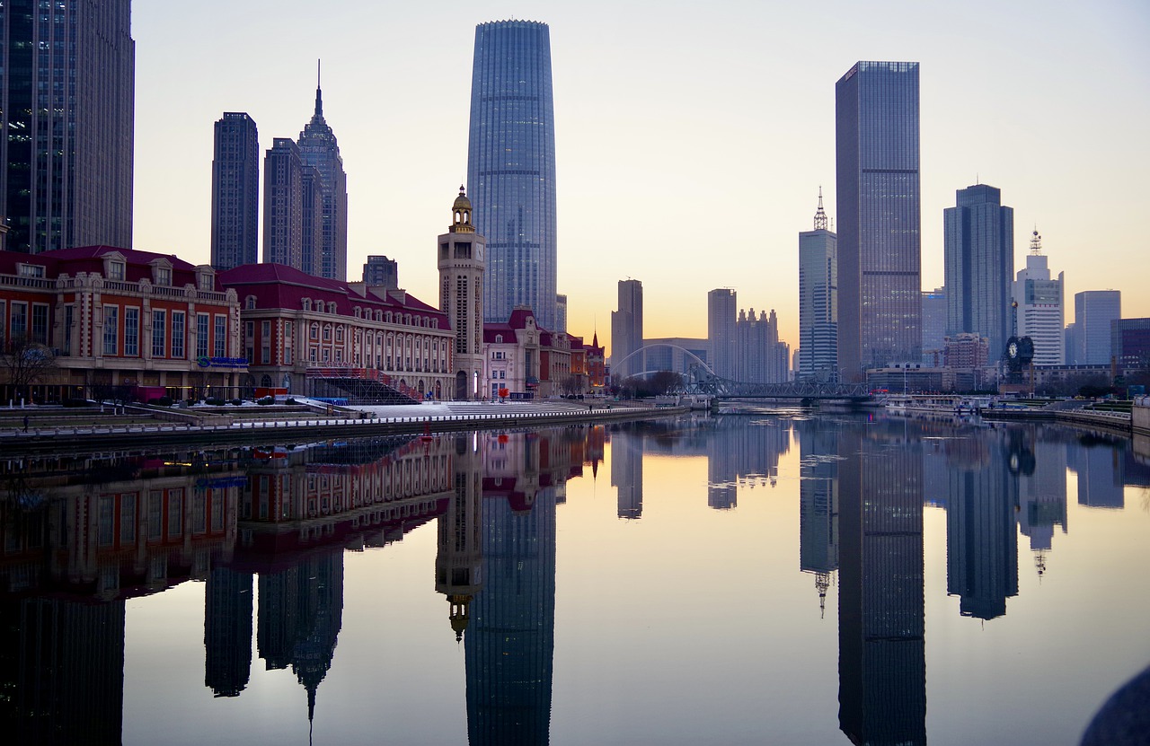 City Buildings Reflections Water  - marcelideler / Pixabay