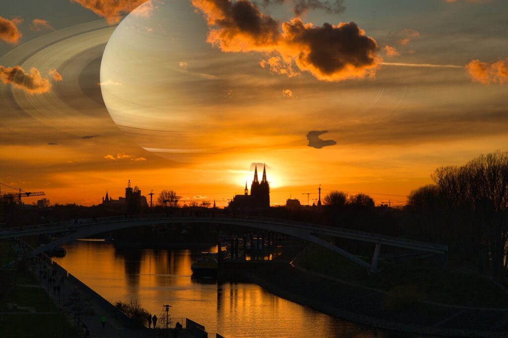 Cologne Saturn Bridge Sunset River  - norberthentges / Pixabay