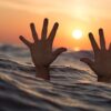 Drowning Man Sea Hands  - Tumisu / Pixabay