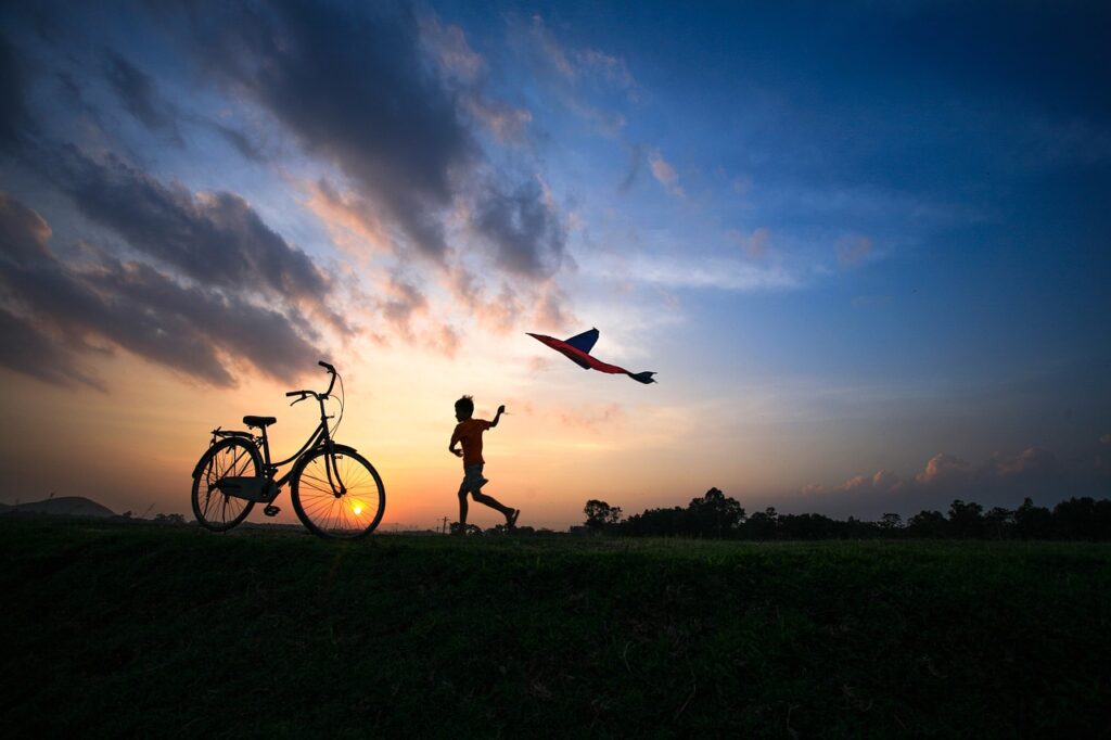 field child bike kite sunset fun 6558125