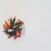 colored pencils in top view photography