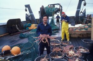 man holding brown crab