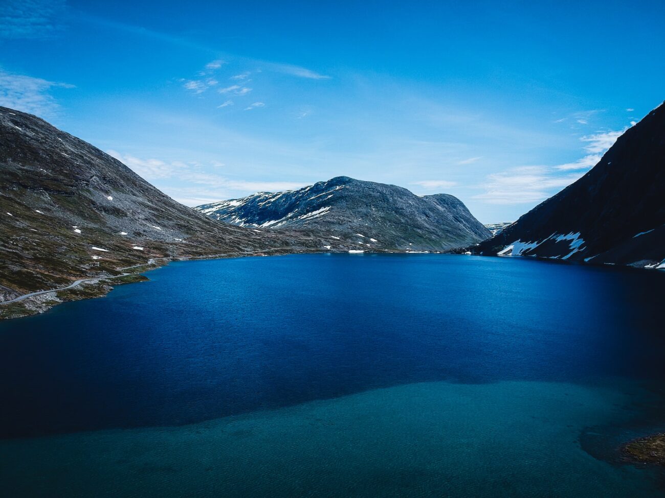 body of water surrounded by mountains