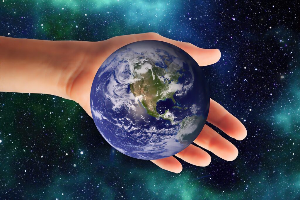 Hand Earth Space World Universe  - Ray_Shrewsberry / Pixabay