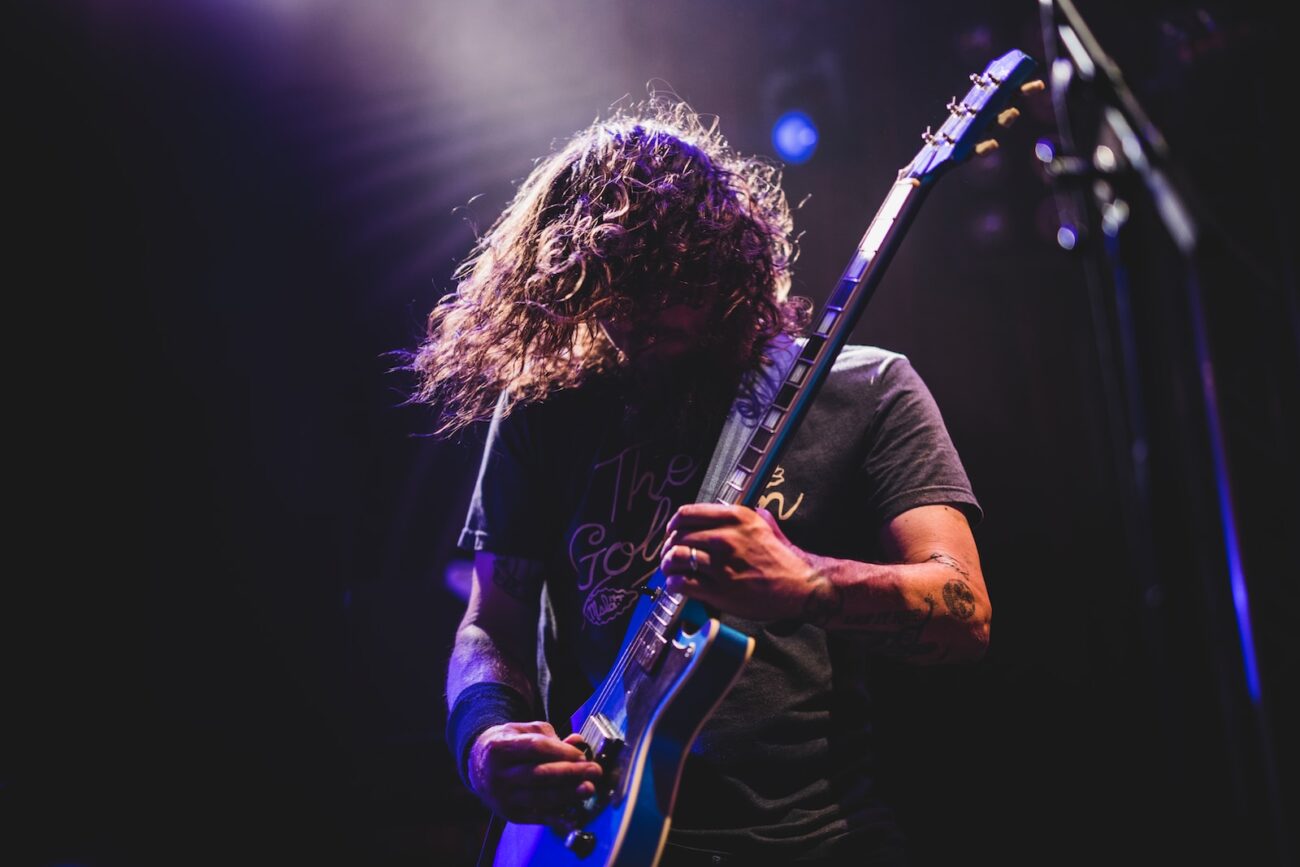 man playing electric guitar