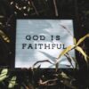 God is Faithful signage with leaved background