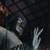 black Buddha statue inside room