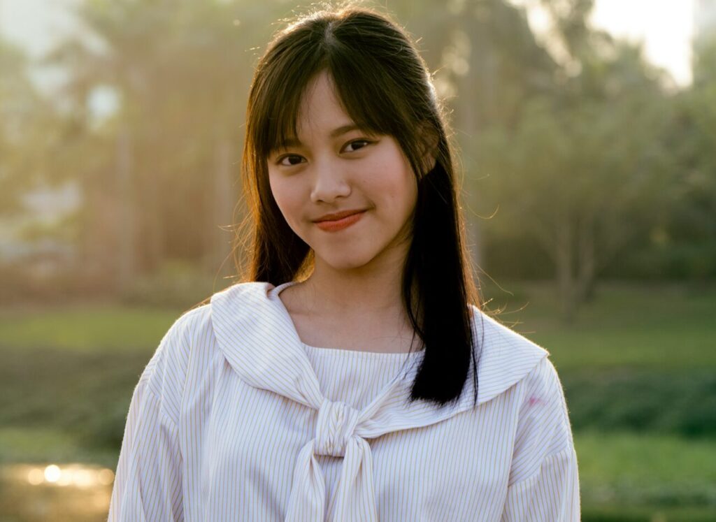 woman in white striped top