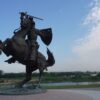 a statue of a man on a horse with a sword