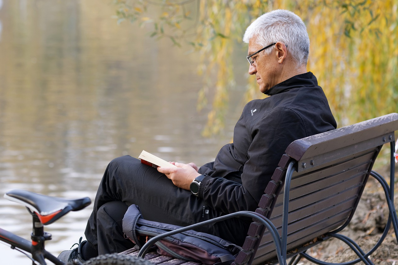 Man Bench Reading Book Outdoors  - Surprising_Shots / Pixabay
