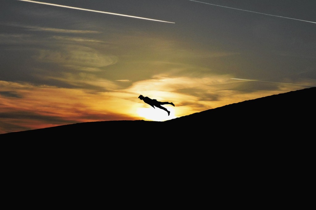 Man Flying Sunset Sunrise Sun  - AlemCoksa / Pixabay