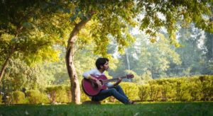 Man Guitar Field Playing Guitar  - Stockfoo / Pixabay