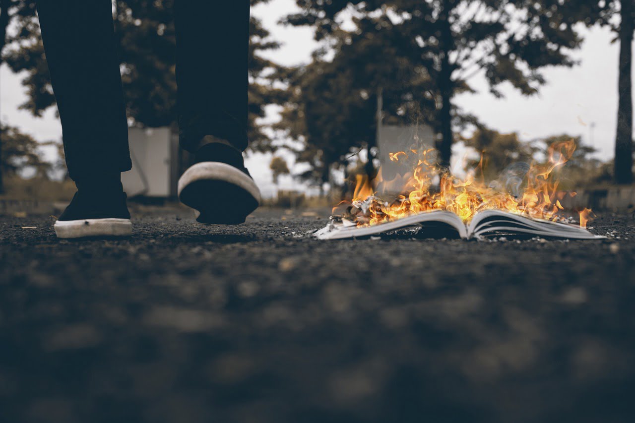 Man Walking Burning Book Burnt  - Om_Om_Om / Pixabay