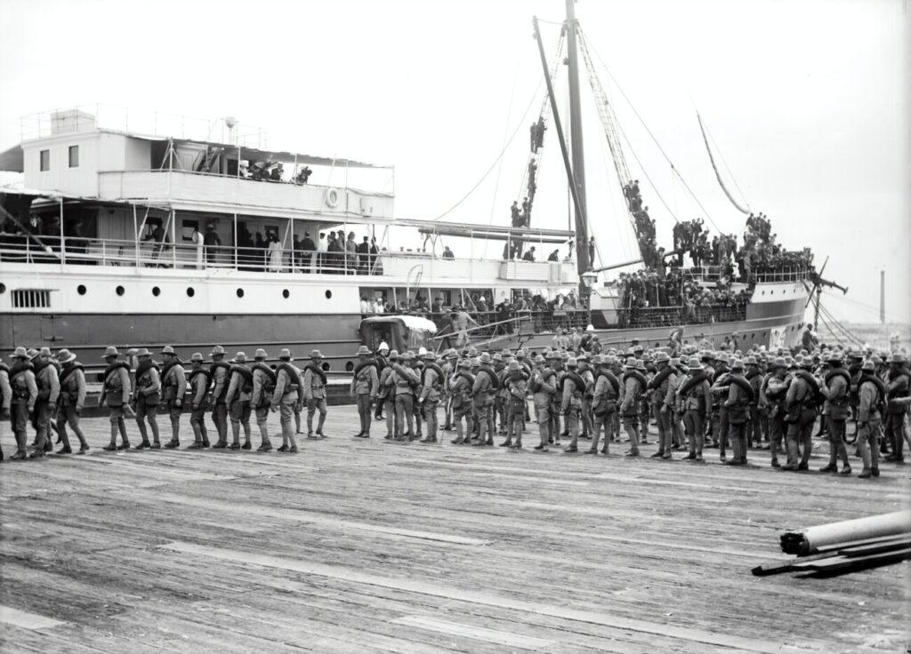 group of boy's standing near on ship
