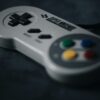 SNES controller on black surface