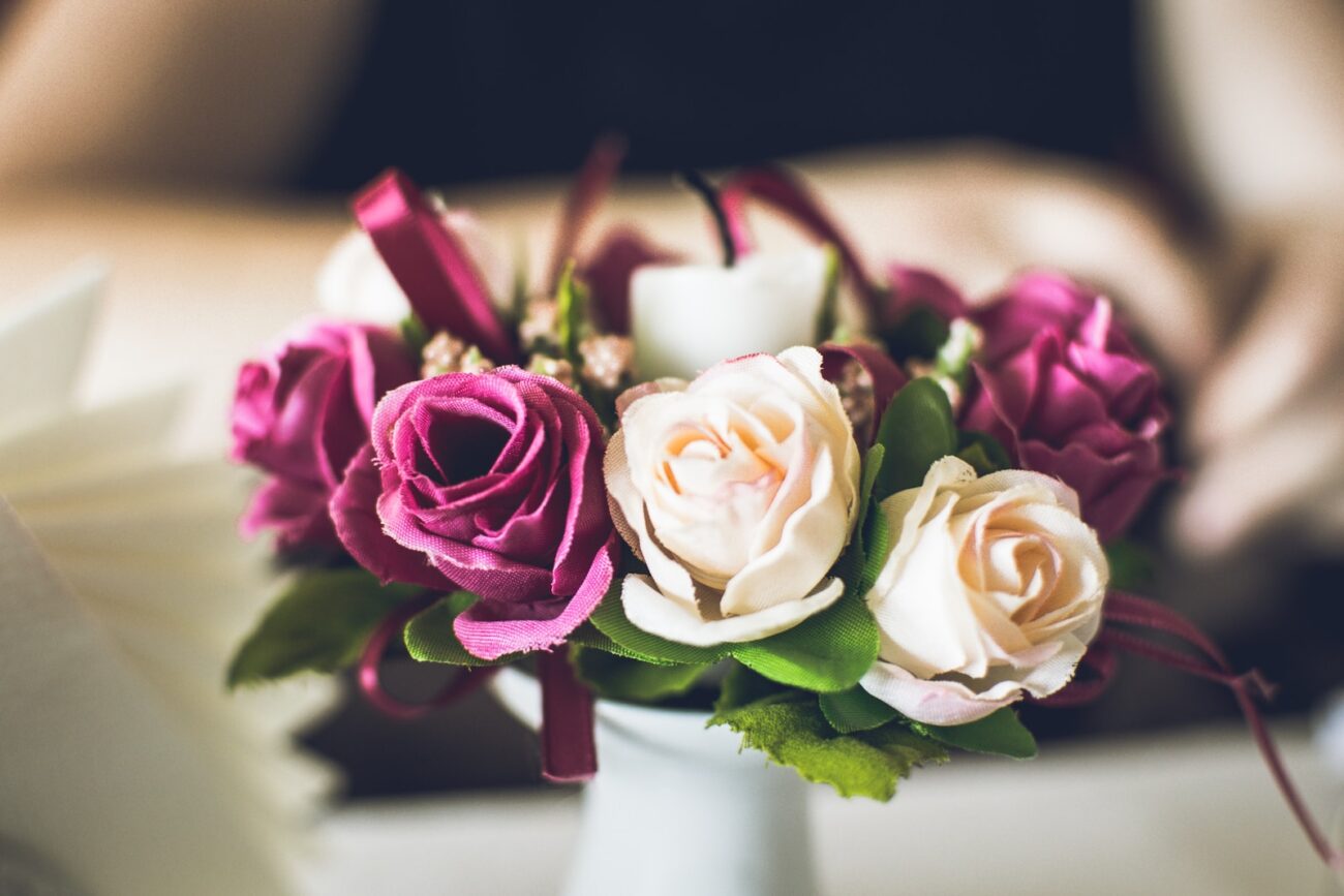 pink and white roses on white table