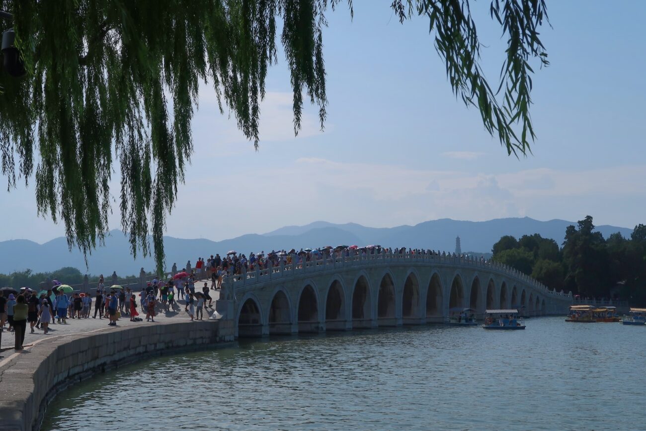 people walking on gray concrete bridge during daytime