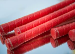 red plastic tube lot on white surface