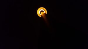 a close up of a street light in the dark