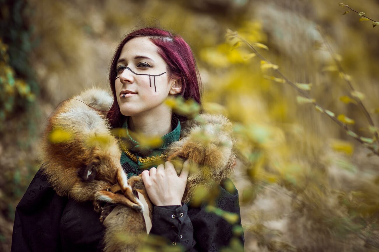 woman in black and brown fur coat