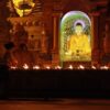 gold buddha statue in front of gold buddha statue
