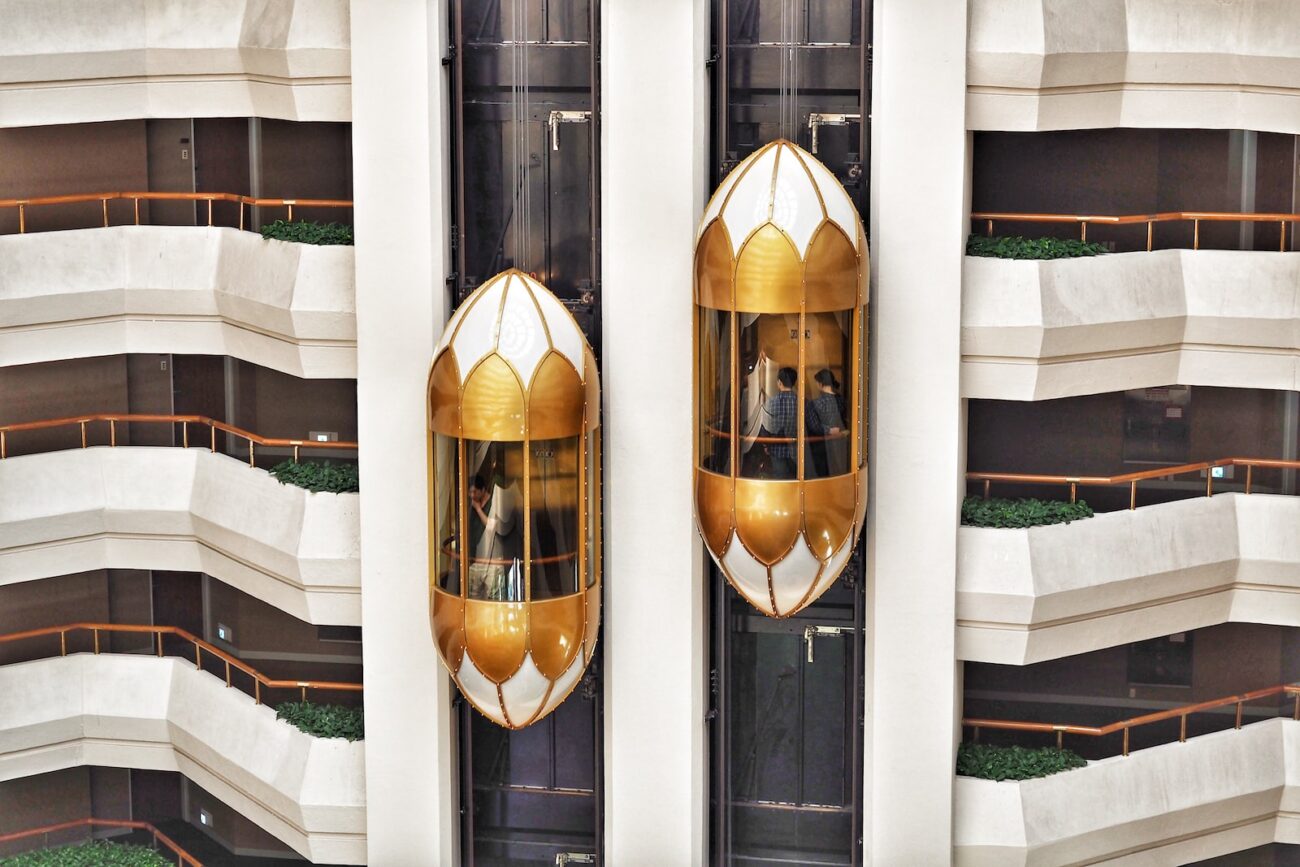 two gold capsule elevator