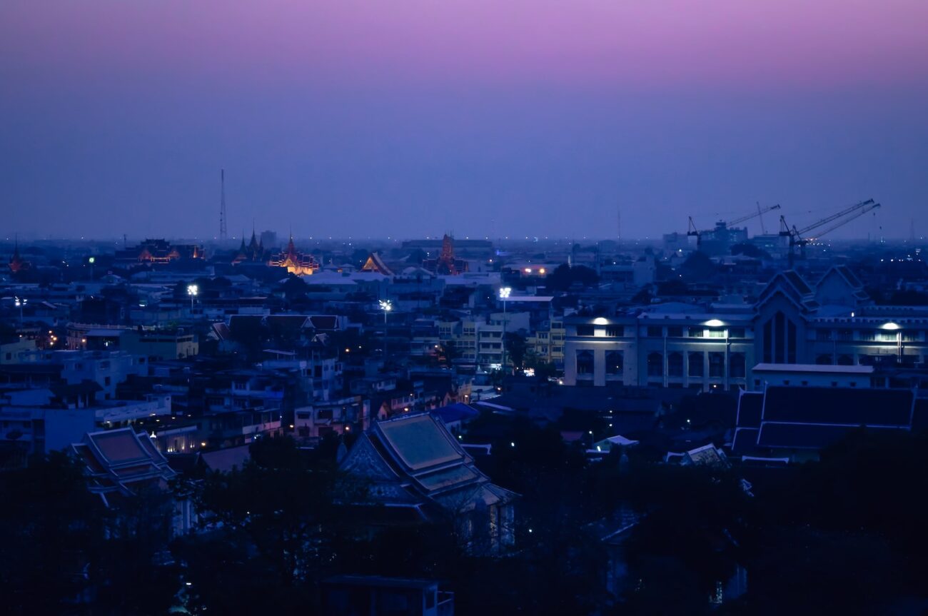 a view of a city at night from a hill