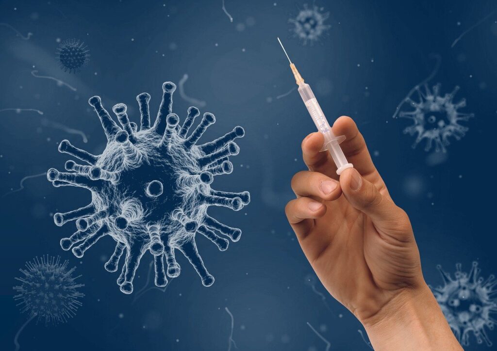 Syringe Hand Virus Injection  - wir_sind_zwei / Pixabay