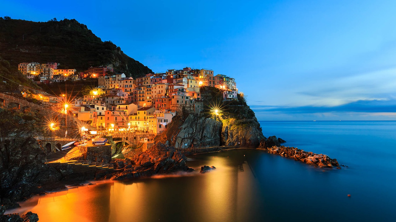 Town Sea Manarola Lights Twilight  - visscreativ / Pixabay
