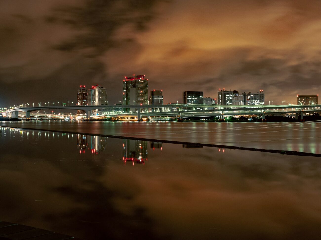 a view of a city at night from across the water