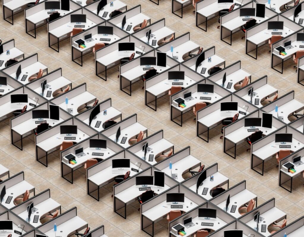 a room filled with lots of desks and computers