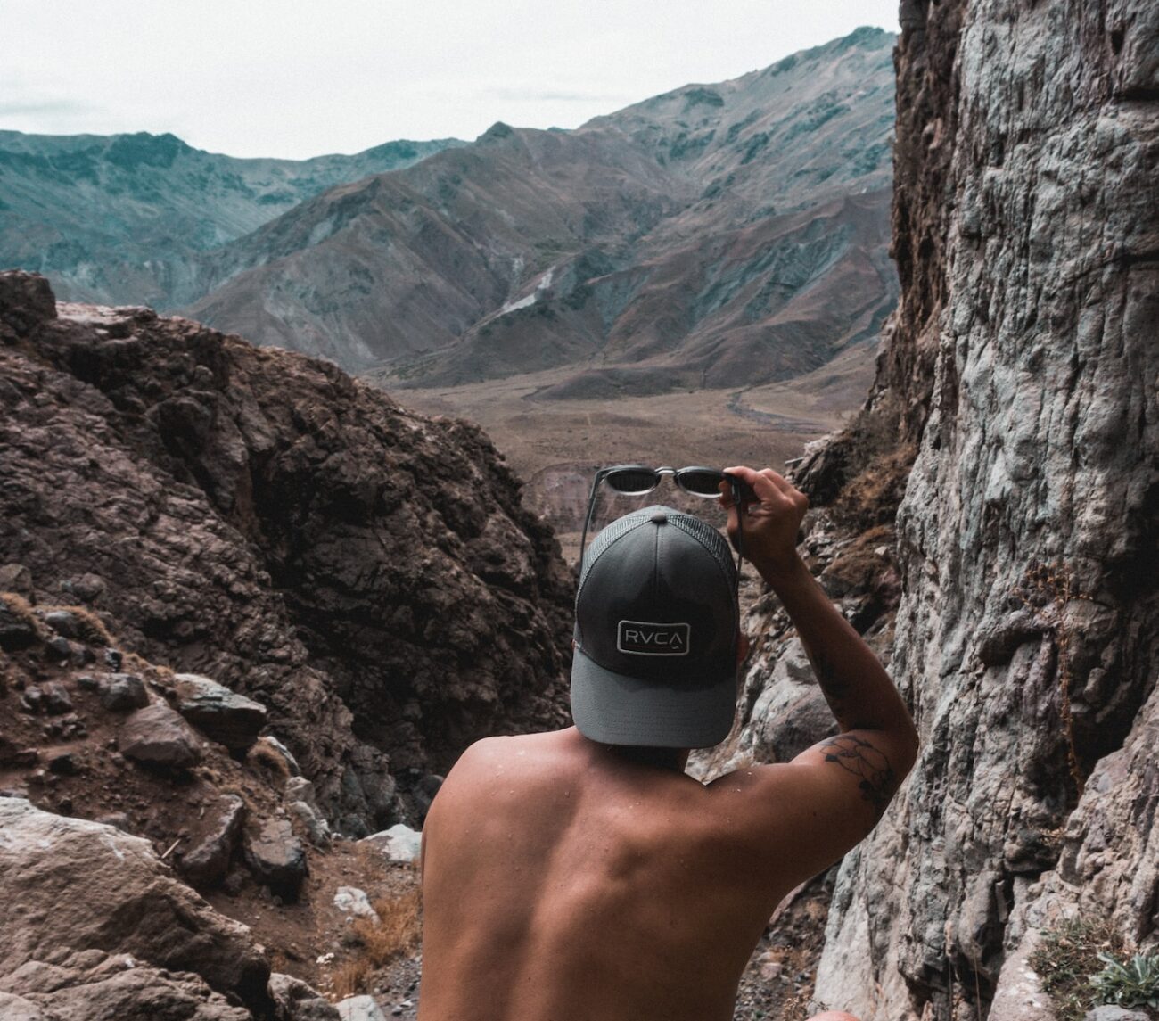 man holding sunglasses
