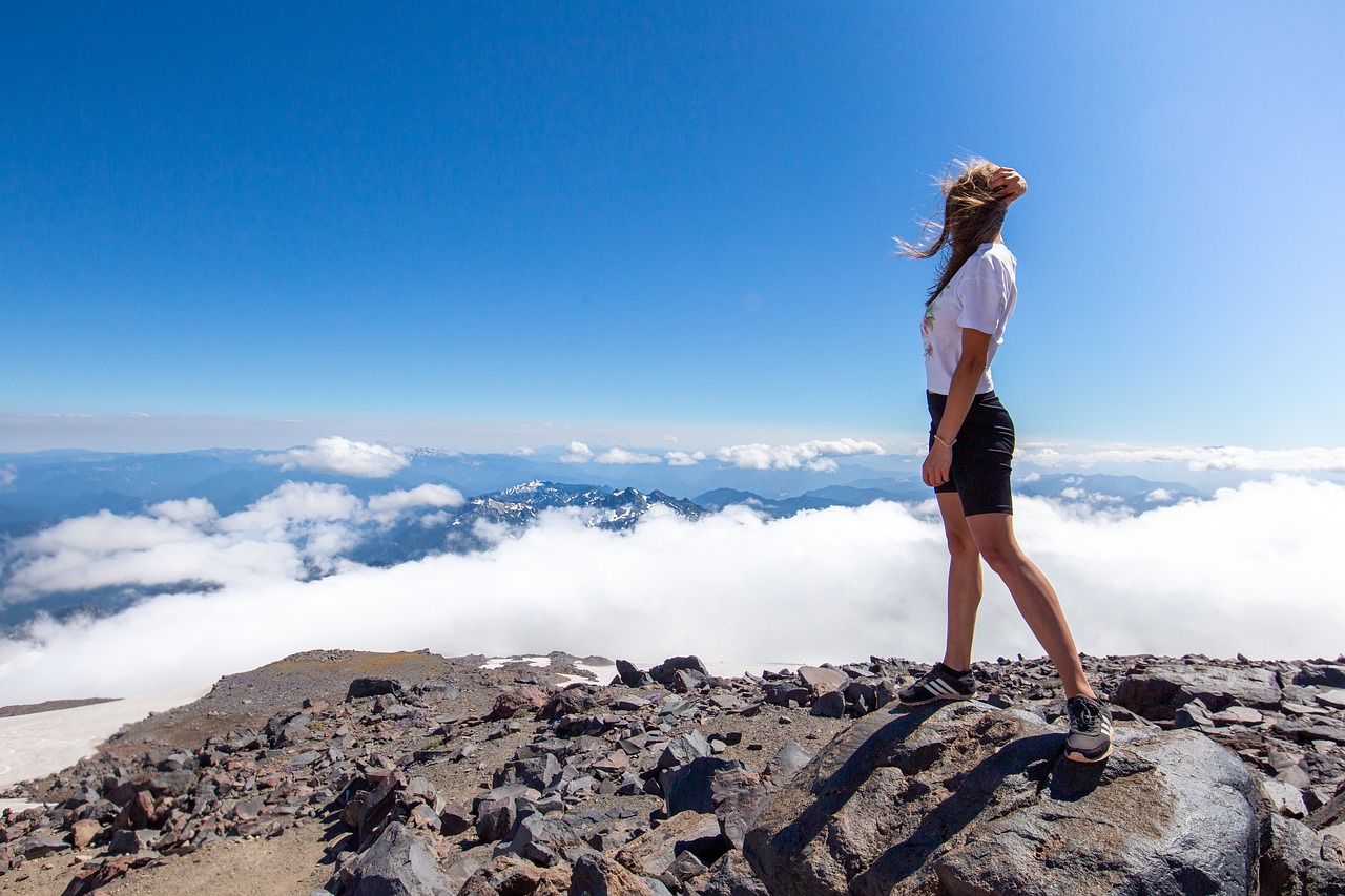 Woman Peak Summit Clouds  - sergiumarvel / Pixabay