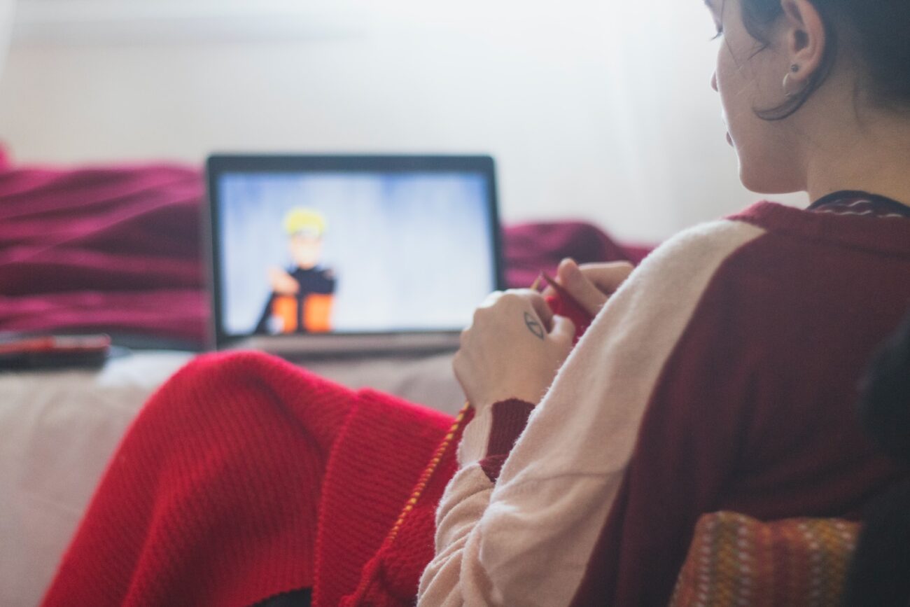 woman in red sweater sitting on chair